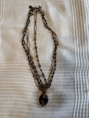 Layered Antique Brass Necklace with Blue Pendant and Beaded Accents